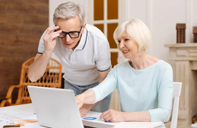 a photo of a couple using a laptop