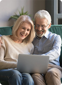 A couple using a laptop