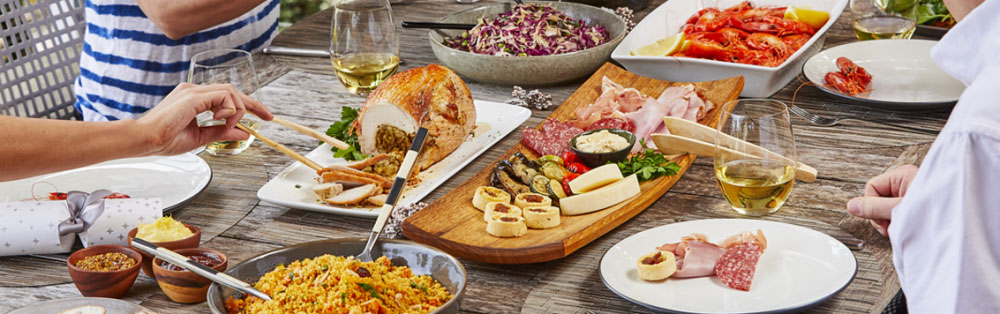 A photo of table at Christmas full of food