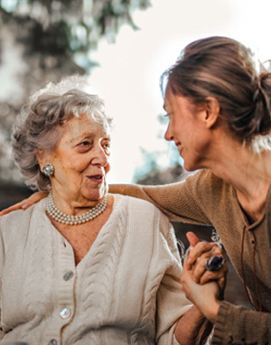 Elderly lady talking to a younger lady